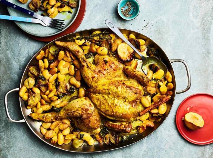 Yotam Ottolenghi’s recipes for roast chicken with butter beans, and potatoes with peppers and garlic